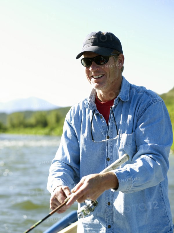 USA, Colorado, Mature man fly-fishing. Photo: John Kelly