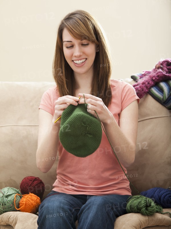 Young woman knitting woolly hat. Photo: Mike Kemp