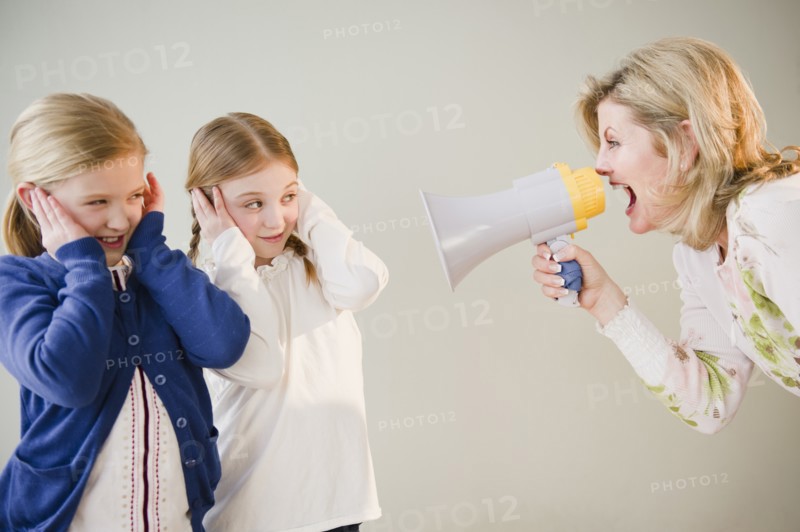 Mother shouting at daughters (8-11) through bullhorn. Photo : Jamie Grill Photography