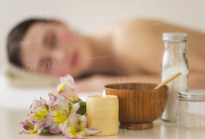 Spa accessories with woman in background. Photo : Daniel Grill