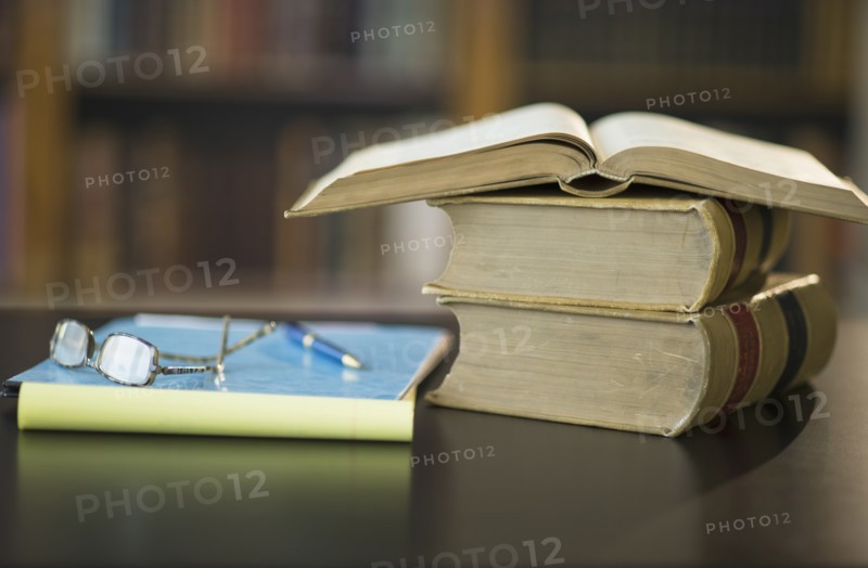 Books on desk in library.