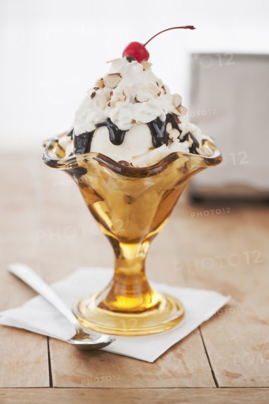 Close up of sundae with cherry on top.