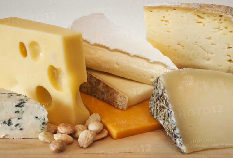Various cheeses on chopping board.
