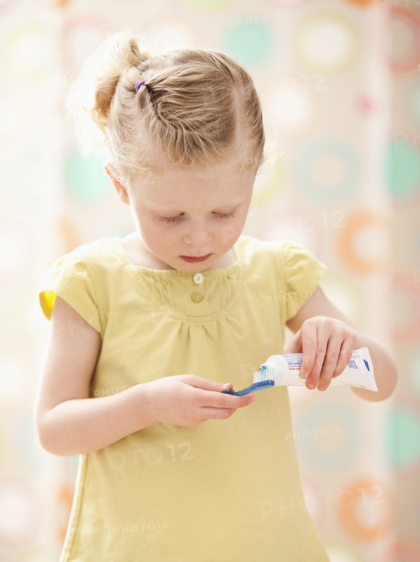 Girl (2-3) brushing teeth. Photo: Mike Kemp