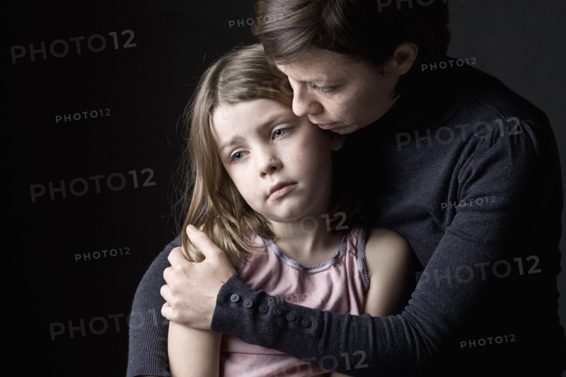 Mother and daughter (6-7) embracing. Photo: Justin Paget