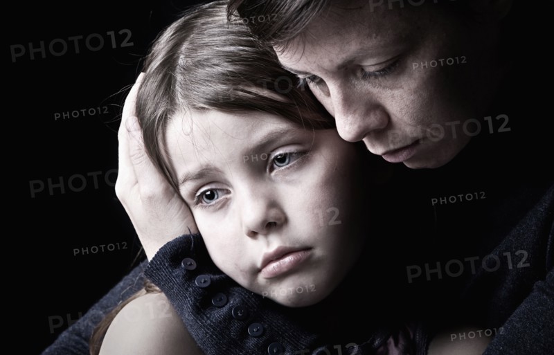 Mother and daughter (6-7) embracing. Photo: Justin Paget