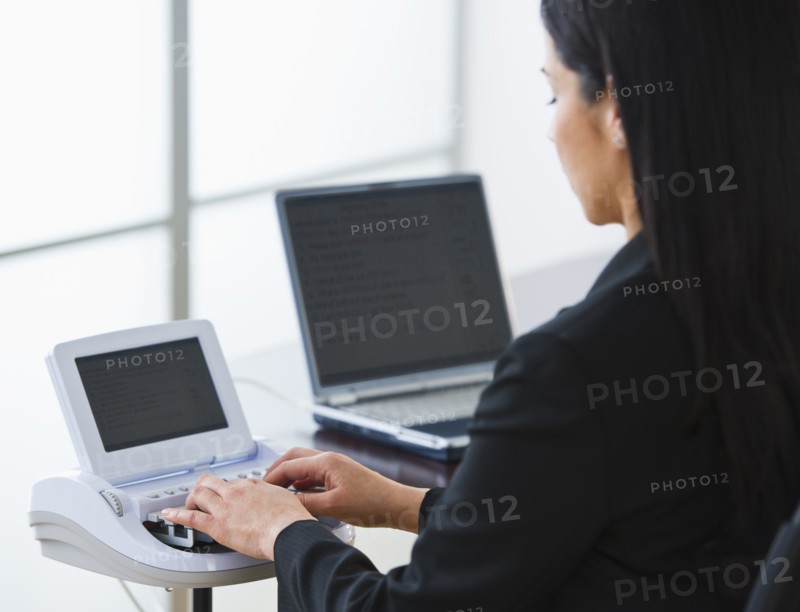 Court stenographer using stenograph machine. Photo: Daniel Grill