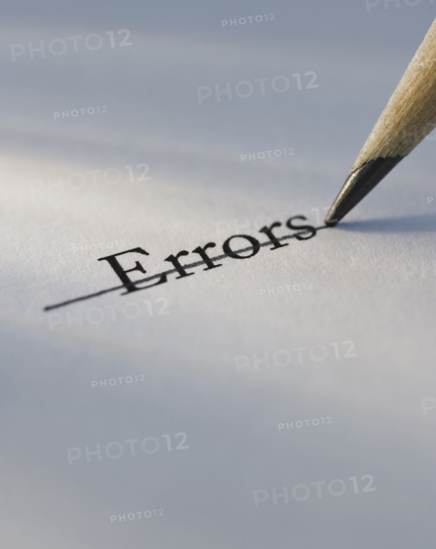 Studio shot of pencil crossing out the word errors from piece of paper. Photo: Daniel Grill