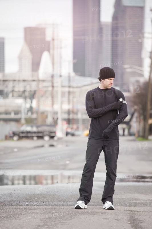 USA, Washington, Seattle, man in workout wear in street. Photo: Take A Pix Media