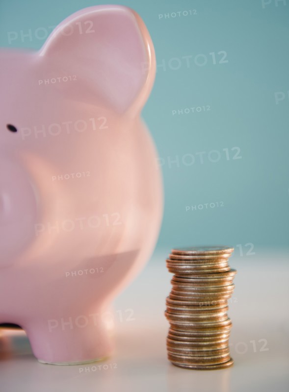 Piggy bank and stack of coins. Photo: Jamie Grill Photography