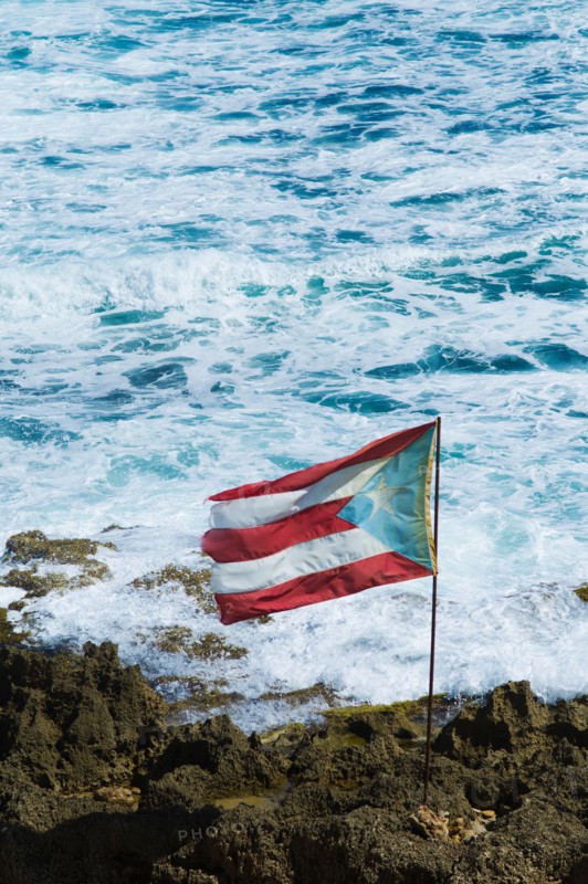 Puerto Rico, Old San Juan, flag of Puerto rice on sea coast.