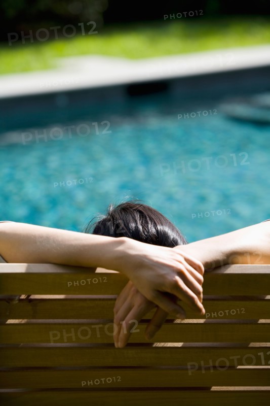 Woman relaxing in chair. Photo : Maisie Paterson