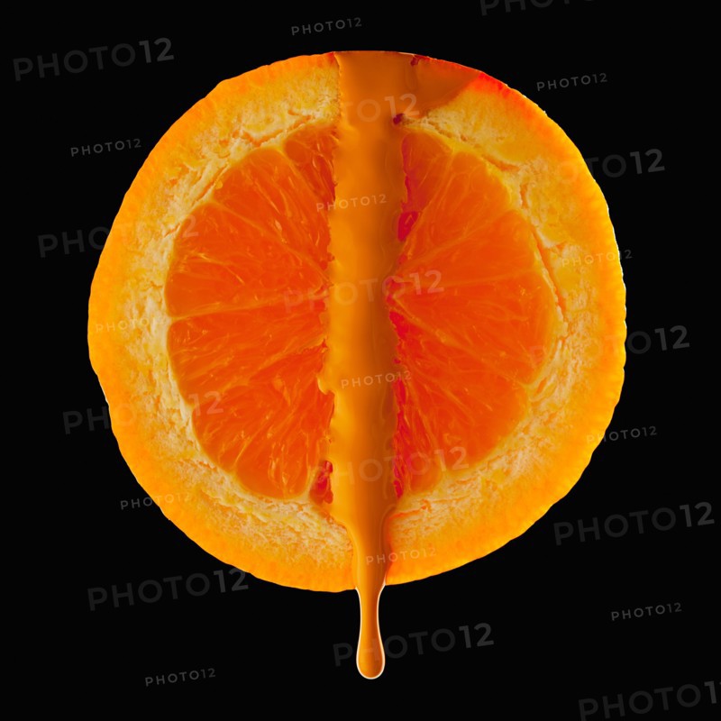 Studio shot of red orange with orange paint. Photo : Mike Kemp