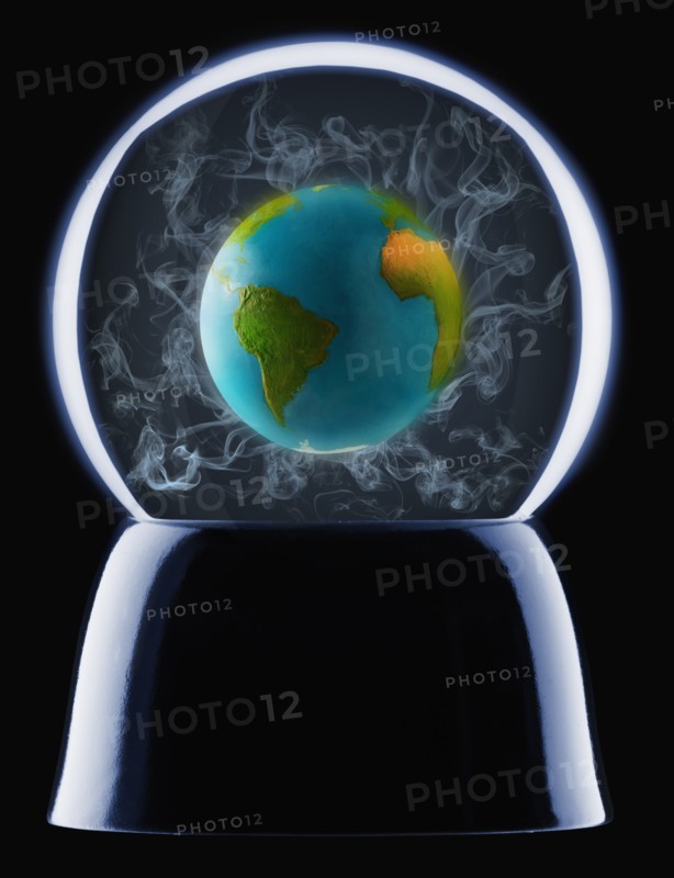 Studio shot of crystal ball showing globe inside. Photo : Mike Kemp