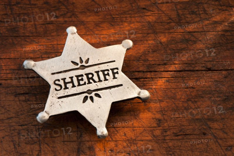 Close-up of Sheriff badge.