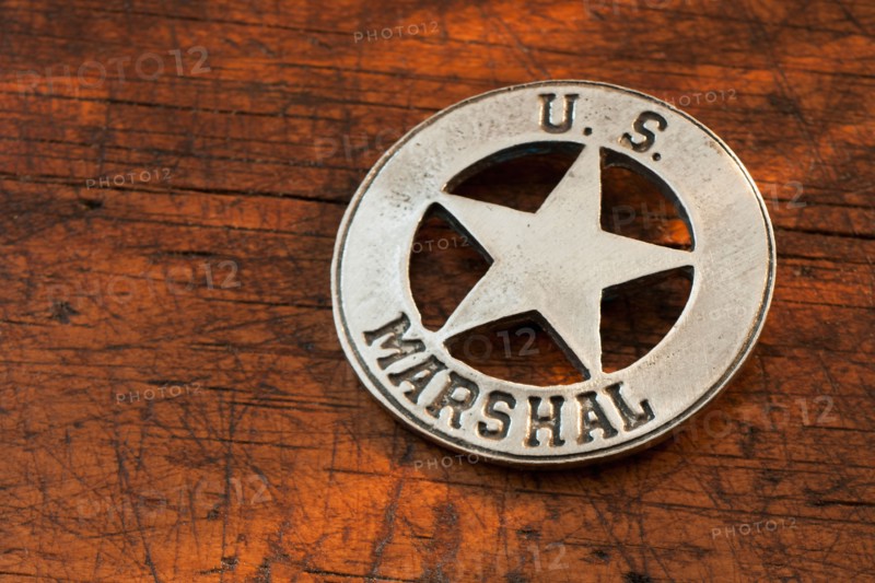 Close-up of United States Marshal badge.