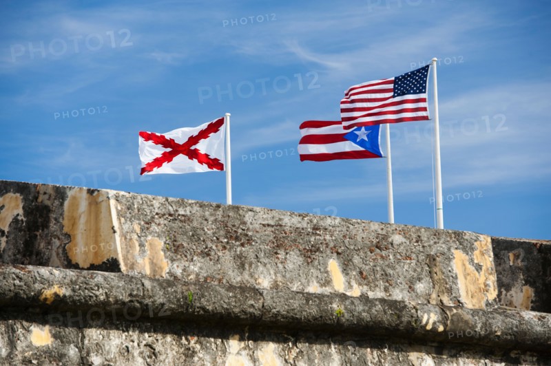 Puerto Rico, Old San Juan, El Morro Fortress, flags behind wall.