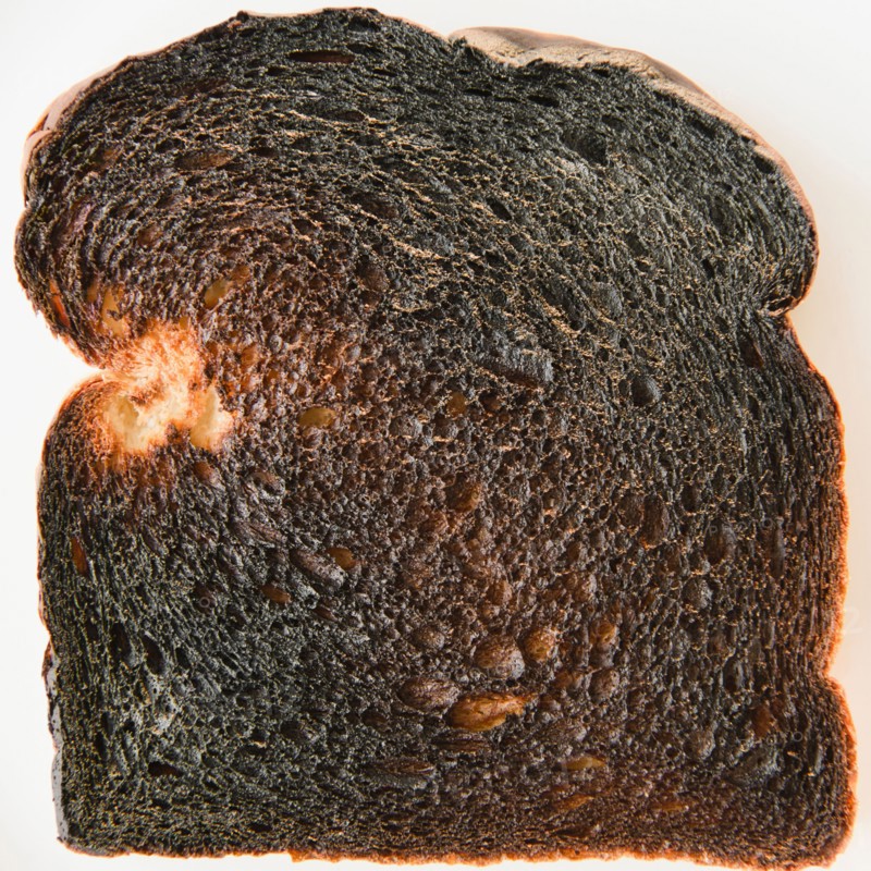 Close up of burnt toast. Photo : Jamie Grill Photography