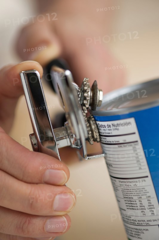 Man opening can.