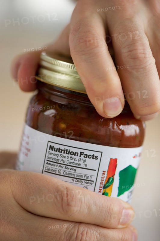 Man opening jar.