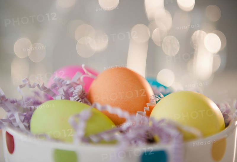 Colored Easter eggs in bowl, studio shot. Photo : Jamie Grill Photography