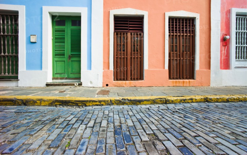 Puerto Rico, Old San Juan, door in houses on brick street.