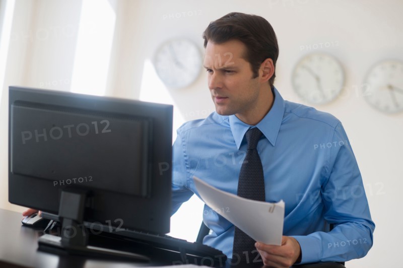 Businessman working on computer.