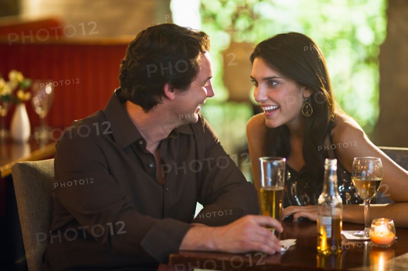 Couple drinking in restaurant.