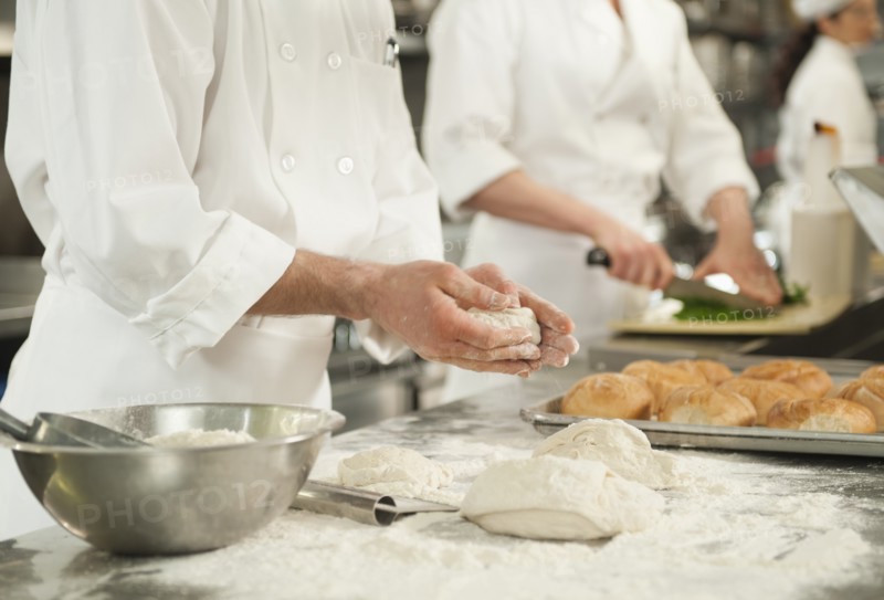 Chef doing pastry to make rolls.