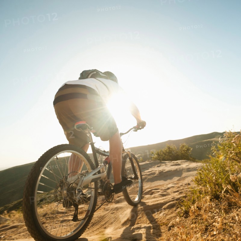 USA, California, Laguna Beach, Mountain biker riding downhill.