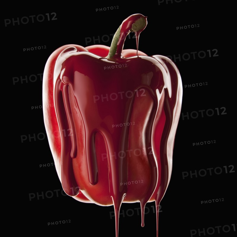Studio shot of red bell pepper covered with red paint. Photo : Mike Kemp