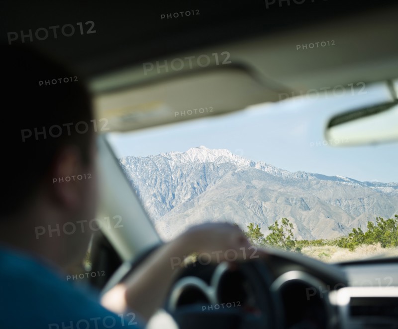 USA, California, Palm Springs, Coachella Valley, San Gorgonio Pass, Close up of man inside car. Photo : Jamie Grill Photography