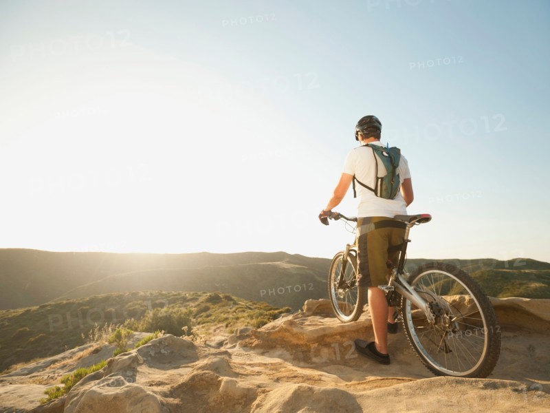 USA, California, Laguna Beach, Mountain biker on top of hill.