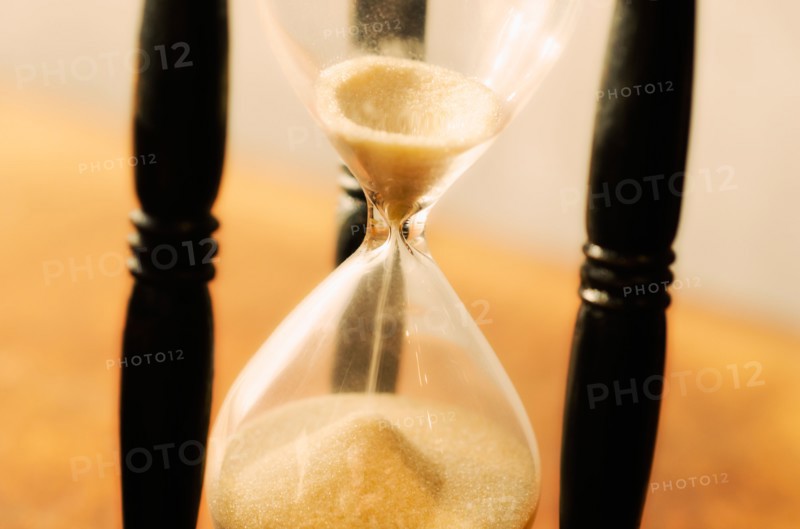 Hourglass with pouring sand.