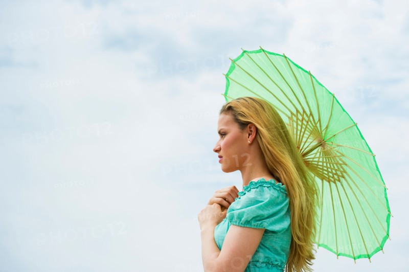 Woman holding parasol.