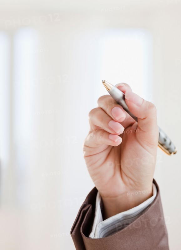 Close up of woman's hand holding pen. Photo: Jamie Grill