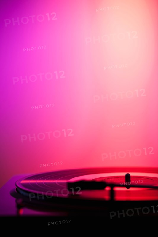 Close up of turntable on pink background. Photo: Daniel Grill