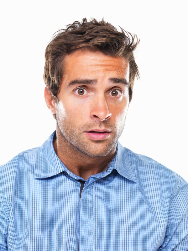 Studio portrait of young of shocked business man. Photo: momentimages