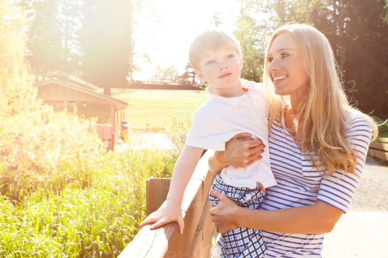 Young woman embracing son (2-3) in park. Photo : Take A Pix Media