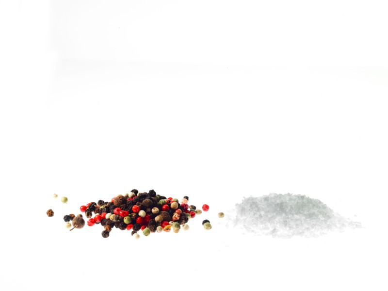 Studio shot of mixed pepper corns and coarse salt. Photo: David Arky