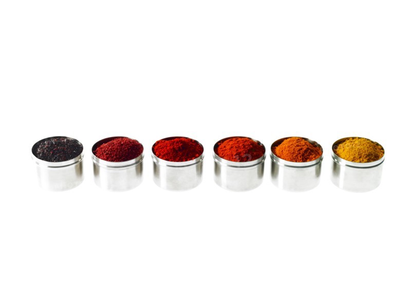Studio shot of row of jars with spices. Photo : David Arky