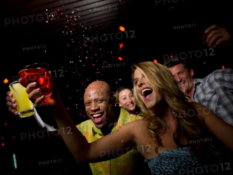 Friends enjoying drinks at bar. Photo: db2stock