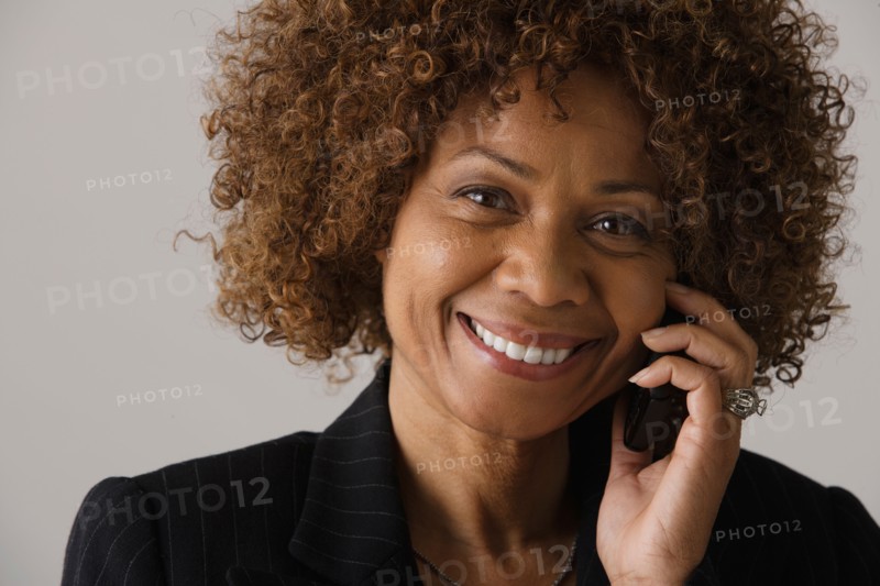 Portrait of mature businesswoman, studio shot. Photo : Rob Lewine