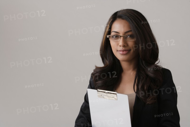 Portrait of young businesswoman, studio shot. Photo : Rob Lewine