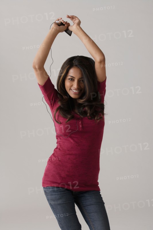 Portrait of young woman, studio shot. Photo: Rob Lewine