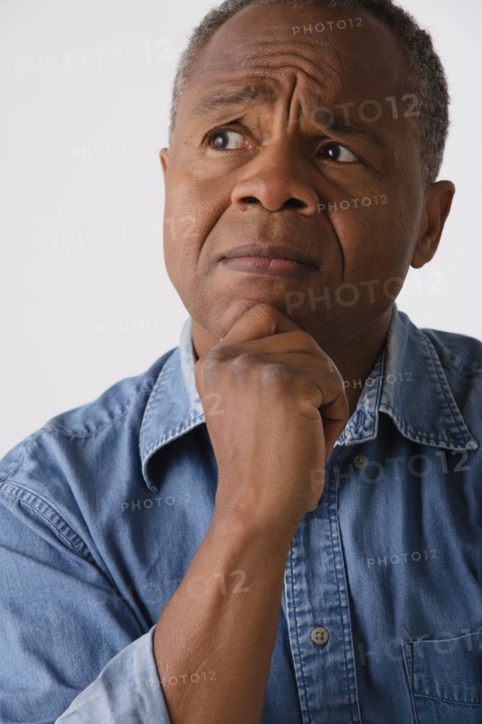 Portrait of mature man, studio shot. Photo: Rob Lewine