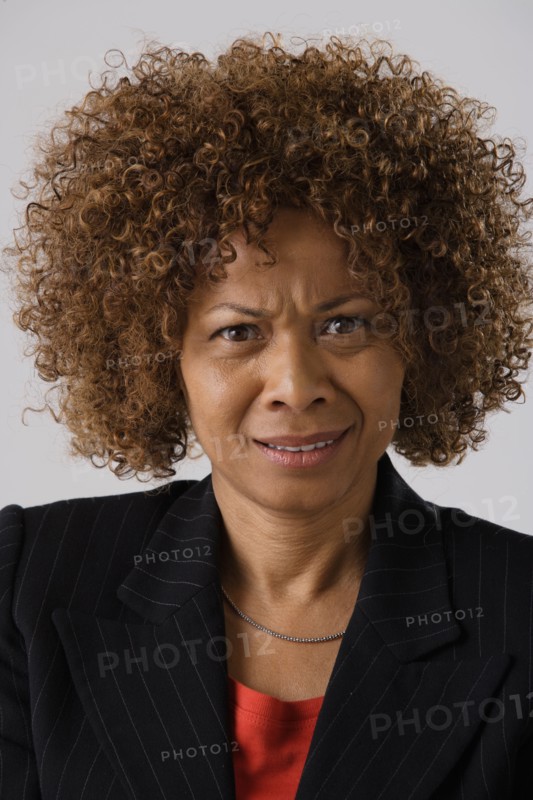 Portrait of mature businesswoman, studio shot. Photo : Rob Lewine