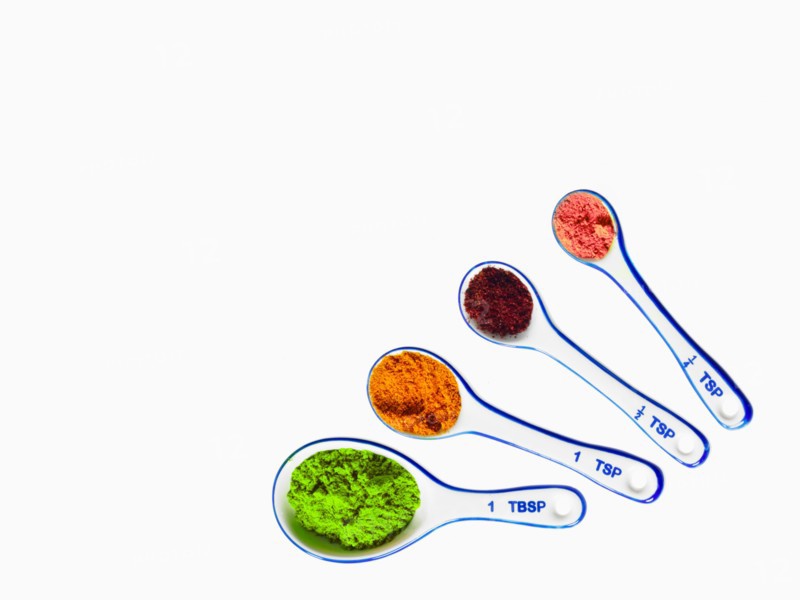 Studio shot of piles of spices on measuring spoons. Photo: David Arky