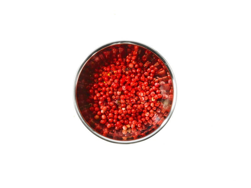 Studio shot of Red Chili Flakes in pan on white background. Photo : David Arky