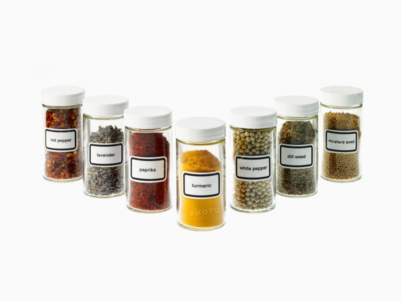 Studio shot of Jars with spices on white background. Photo : David Arky